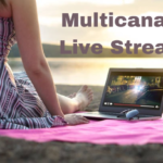 A user streaming a movie on Multicanais using a laptop.