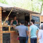 A vibrant food truck serving street tacos at 1500 E Colfax.