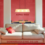 Vibrant King Red accent wall paired with modern furniture in a cozy living room.